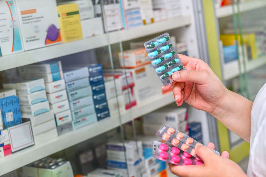 Person holding pills